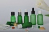 2012 green essential oil bottle with different caps