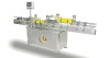 Adhesive sticker up and down fixed position labeling machine / labeling equipment