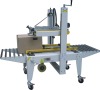 Adhesive tape sealing machines