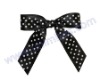 Black and white dots-printed satin ribbon bow with self-adhesive at the back