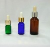 Blue glass essential oil bottle