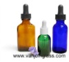 Colorful essential oil bottles with glass pipette