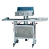 Continuous induction sealing machine