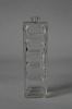 Glass perfume bottle with wave surface