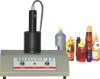 Handheld sealing machine for sharp lids