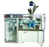 Horizontal liquid filling and packing machine