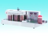 Large bottle sealing machine with foil