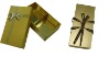 Luxury paper gift box with golden paper and ribbon