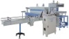 Multiple shrink wrapping machine