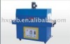 Shrink wrapping machine