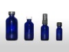 blue essential oil bottle with dropper