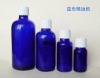 blue essential oil bottle with white screw cap