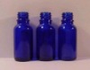 blue glass essential oil bottle