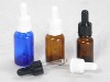 blue glass essential oil bottle with dropper