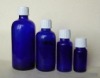 blue glass essential oil bottle with scrow cap