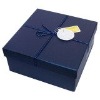 blue paper gift box with ribbon