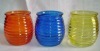 blue, yellow, red candle glass jar