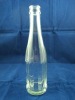 clear beverage glass bottle