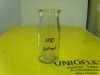 clear glass milk bottle