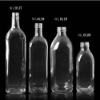 clear glass white wine bottles