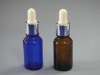 colored essential oil glass bottle