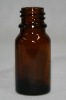 dark brown essential oil glass bottle