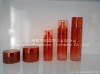 glass cosmetic bottle and jar in red color