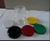 glass jar with colorful tinplate lids