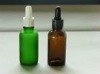 green essential oil bottle