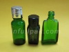 green essential oil bottle