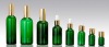 green glass essential oil bottle with scrow cap or dropper