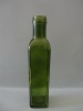 green sprayed glass bottle