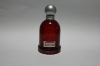 red glass perfume bottle