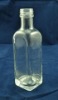 small empty square glass liquor bottle