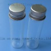 small glass bottle with screw cap