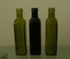 spraying finishing olive oil glass bottle