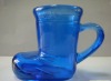 spraying leather boot candle glass cup