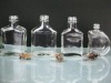 square clear glass wine bottle