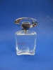 square glass perfume bottle with foil cap