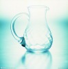 transparent coloured glass tea cup with liquid