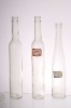 transparent glass wine bottle with cork or screw cap