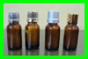 variety of amber ,blue ,green essential oil bottle