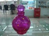 woman glass perfume bottle